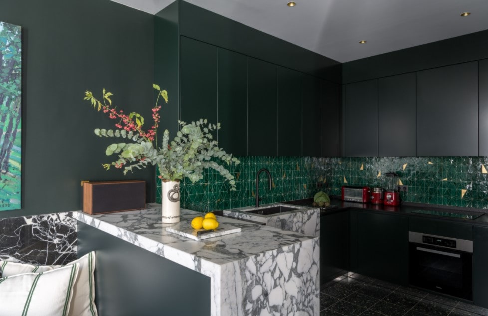 Main Kitchen Interior Trends and Design Ideas 2022. dark green color scheme and marble imitation for the central island