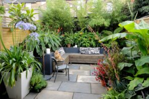 How to Make the Most Out of Your Garden. Nice patio zone with large stone tile and cozy furniture with blankets