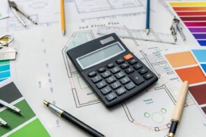 4 Tips for Sticking to Your Renovation Budget. The calculations and the paper floor plan on the table