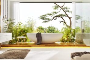 How To Create A Luxurious Bathroom At Home. Chic looking eggshell bathtub of artificial stone at the bakground of panoramic window with the great view to the nature