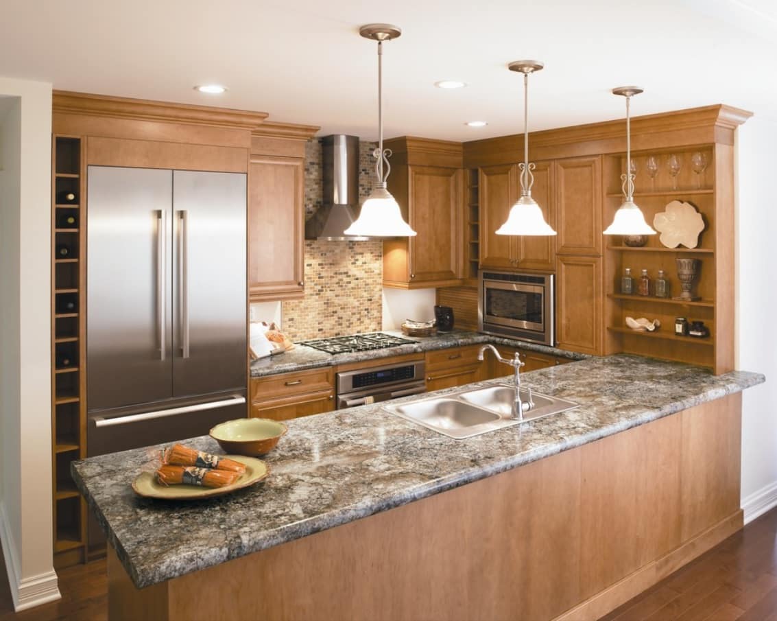 How Long Do Laminate Countertops Last. Wooden trimmed kitchen with faux marble countertop and classic tap