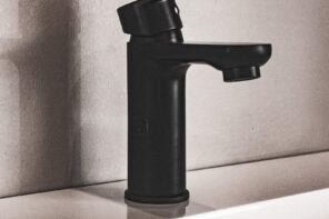 What Is the Best Material To Use for Your Faucet? Black plastic coated faucet close-up