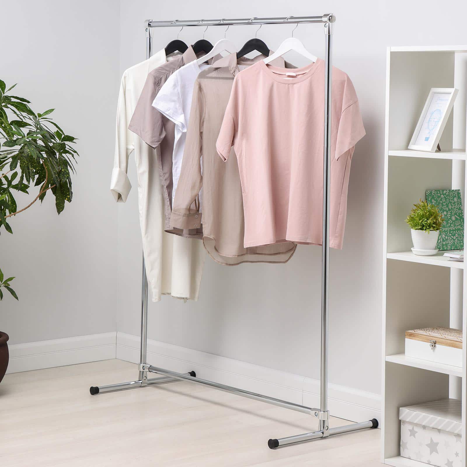 5 Easy Decluttering Hacks For Your New Home. Portable mobile clothes wardrobe at the casual interior