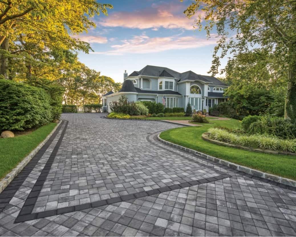 Why You Should Use Concrete Pavers in Your Landscape. Great American style house with paved territory