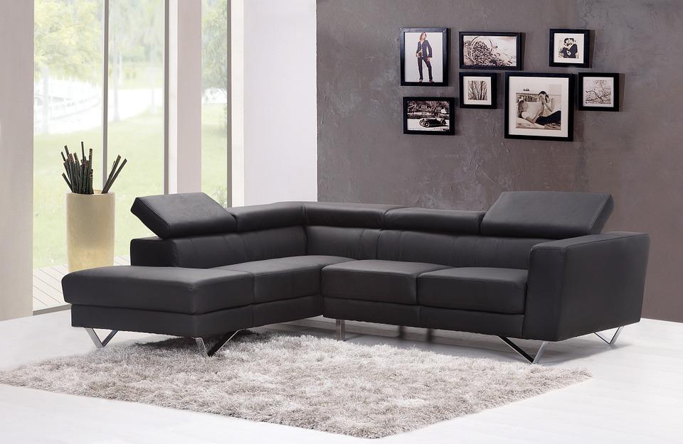 Useful Tips On How To Design A Relaxing Spot In Your House. Chic modern black leather angular sofa for the gray painted living room