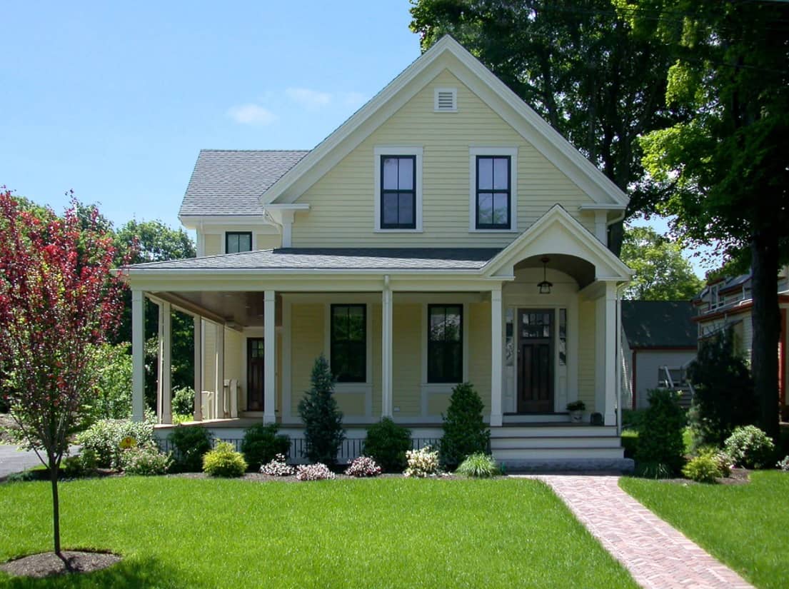 5 Popular Exterior Home Projects for Spring. Classic English style house with trimmed lawn in front