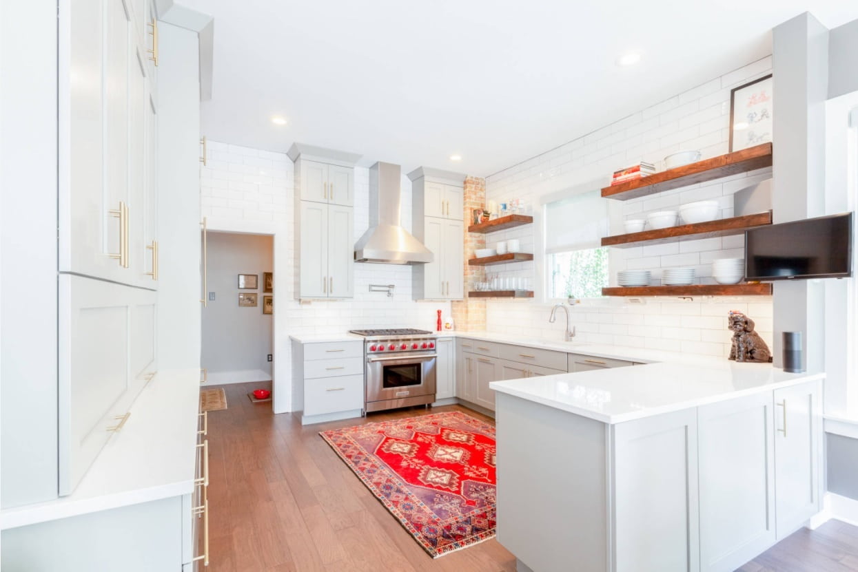 4 Popular Shelves for Homes and Farmhouses. Nice colorful Arabic rug and contrasting to the white casual interior open shelves in the U-shaped kitchen