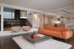 Stylish Living Room Flooring Ideas for Every Type of Home. Modern interior with a gray fluffy rug with a coffee table in the center, and a different furniture around central leisure zone