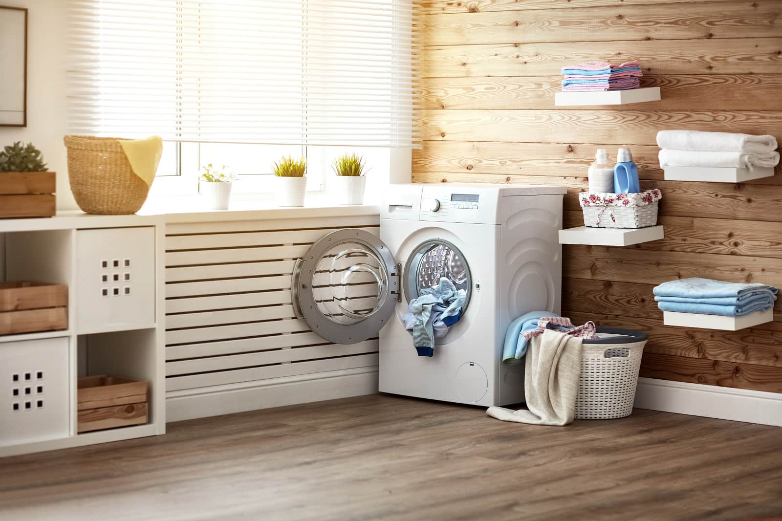 6 Laundry Room Design Ideas And Tips. Spacious room with the wooden plank shield masked radiator and wooden sheathed walls 