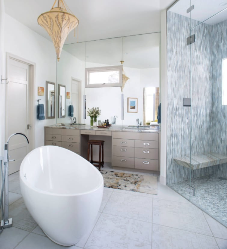How to Make a Bathroom Much Cozier and More Stylish. Glass zoned shower with the bench and the eggshell bathtub for contemporary styled space with boudoir and unusual chandelier