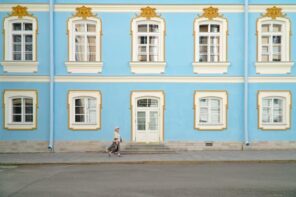 4 Care Tips for Old Or Antique Windows. Blue painted house with ancient carved and gild decorated sash windows