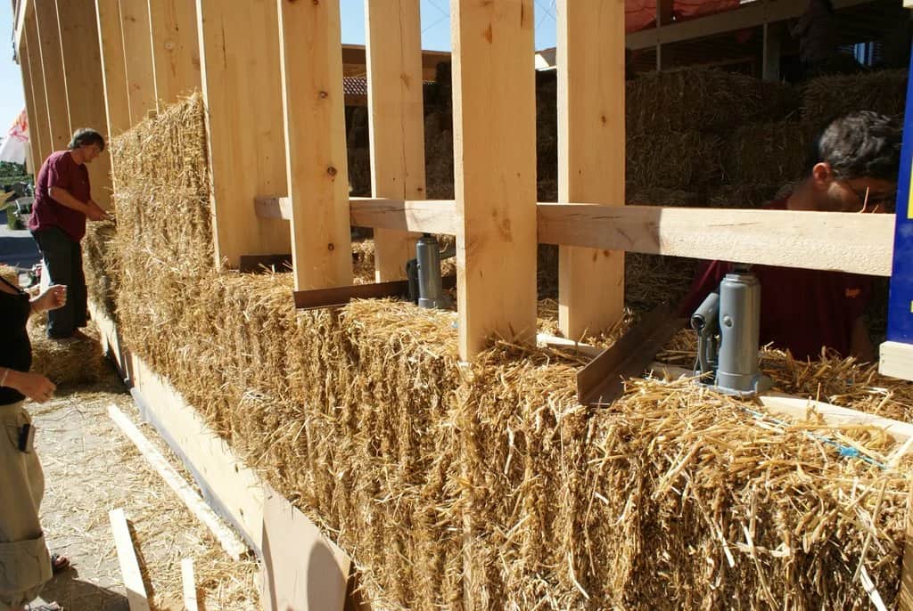 Sustainable Building Materials for an Eco-Friendly Home. Building a wall of straw bales