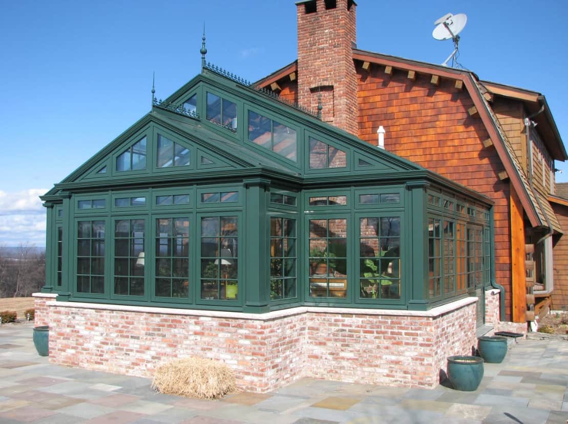 Tips On Where To Place Your Greenhouse. Classic royal English exterior design with sash windows and gabled roof as the annex to the house