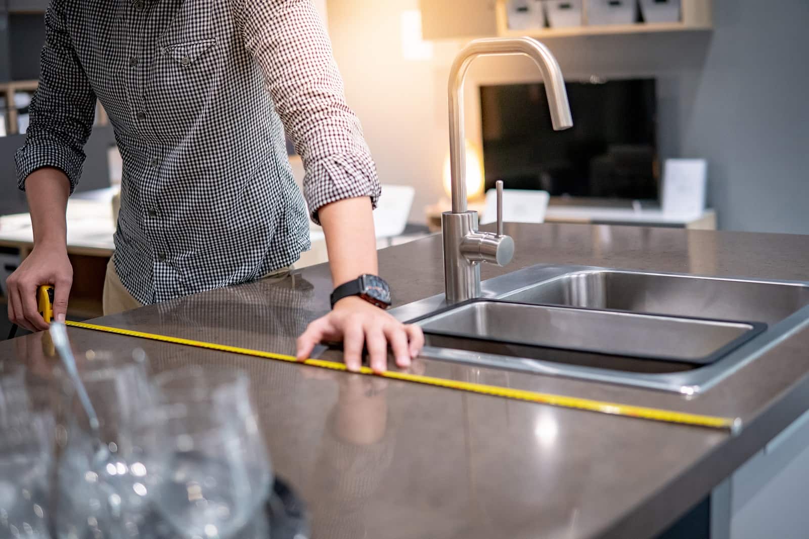 A Homeowner’s Guide To Installing New Kitchen Countertops. Measuring the counter with the ruler