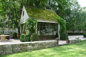 A Guide to Pick the Right Shed for Your Garden. Grass roof simple wooden greenhouse with large sash window