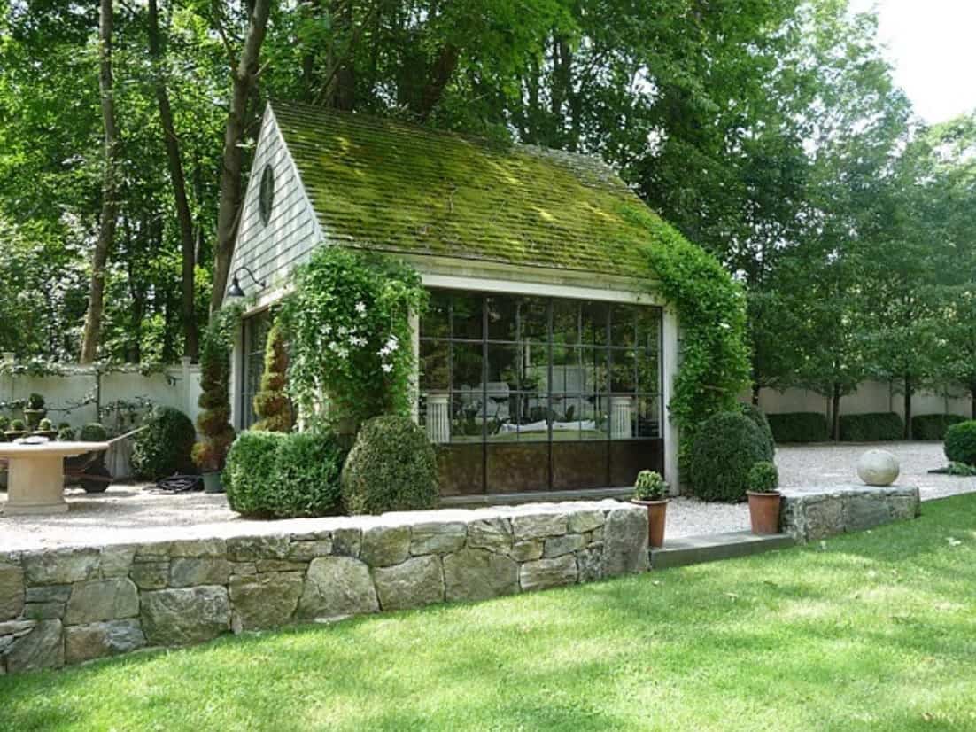 A Guide to Pick the Right Shed for Your Garden. Grass roof simple wooden greenhouse with large sash window