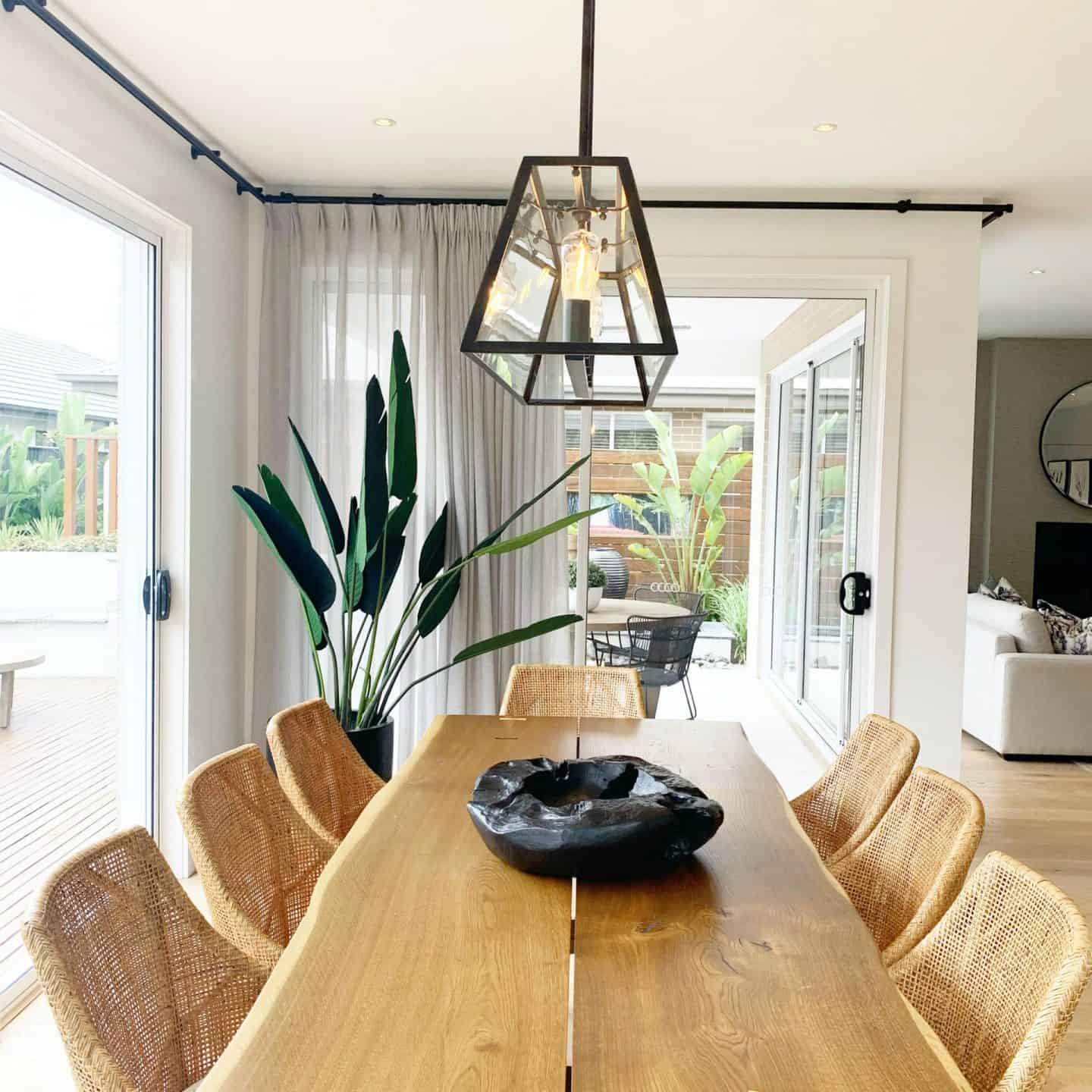 4 Benefits of Implementing a Handmade Dining Table in Your Dining Space. Natural decorated room with light wooden bespoke carved chairs and genuine structure visible on the tabletop