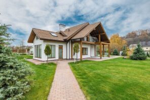 Heating System Design for Your Small Home: 10 Things to Consider. Modern looking cottage in white with technological gable roof