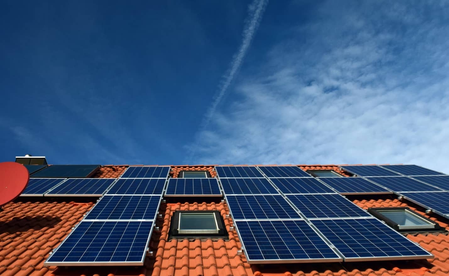 Progressing to Home Solar: Challenges and Tips. The modern panels installed at the orange shingle roof